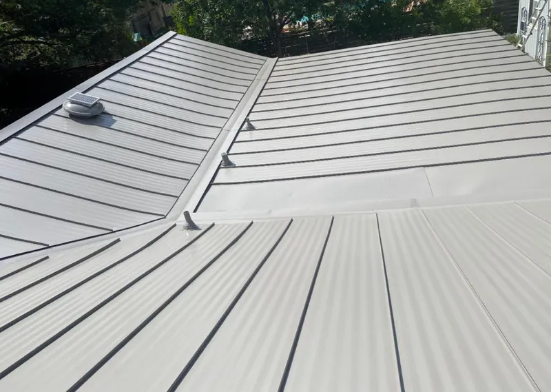 Solar attic fan installed on a metal roof for Roof Ventilation in Gages Lake